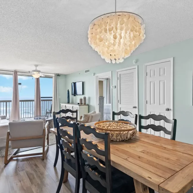 Pensacola Real Estate photography Interior of Home dining room area with gulf of mexico waves ocean view outside window