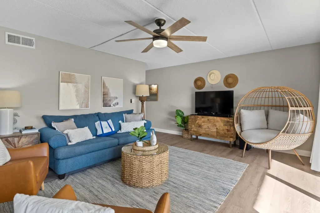 Tips for Captivating Realty Photography That Attracts Buyers 2 Pensacola Real Estate photography Interior of Home blue couch with ciling fan and grey area rug