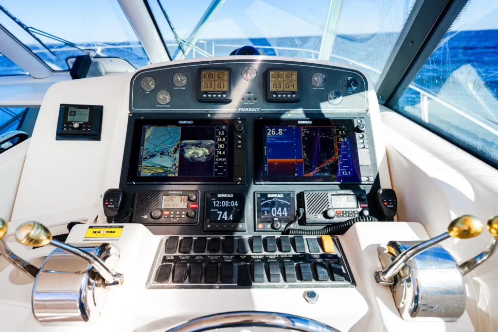 Marine Photography 3 Helm of a sportfishing yacht: multifunction displays, throttles and wheel with the Gulf through the windscreen