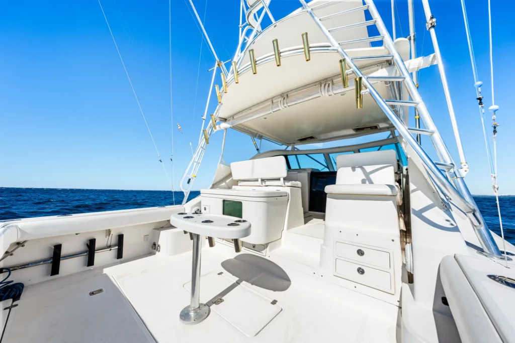 Cockpit and fishing deck of a sportfishing yacht, rod holders and transom door in frame